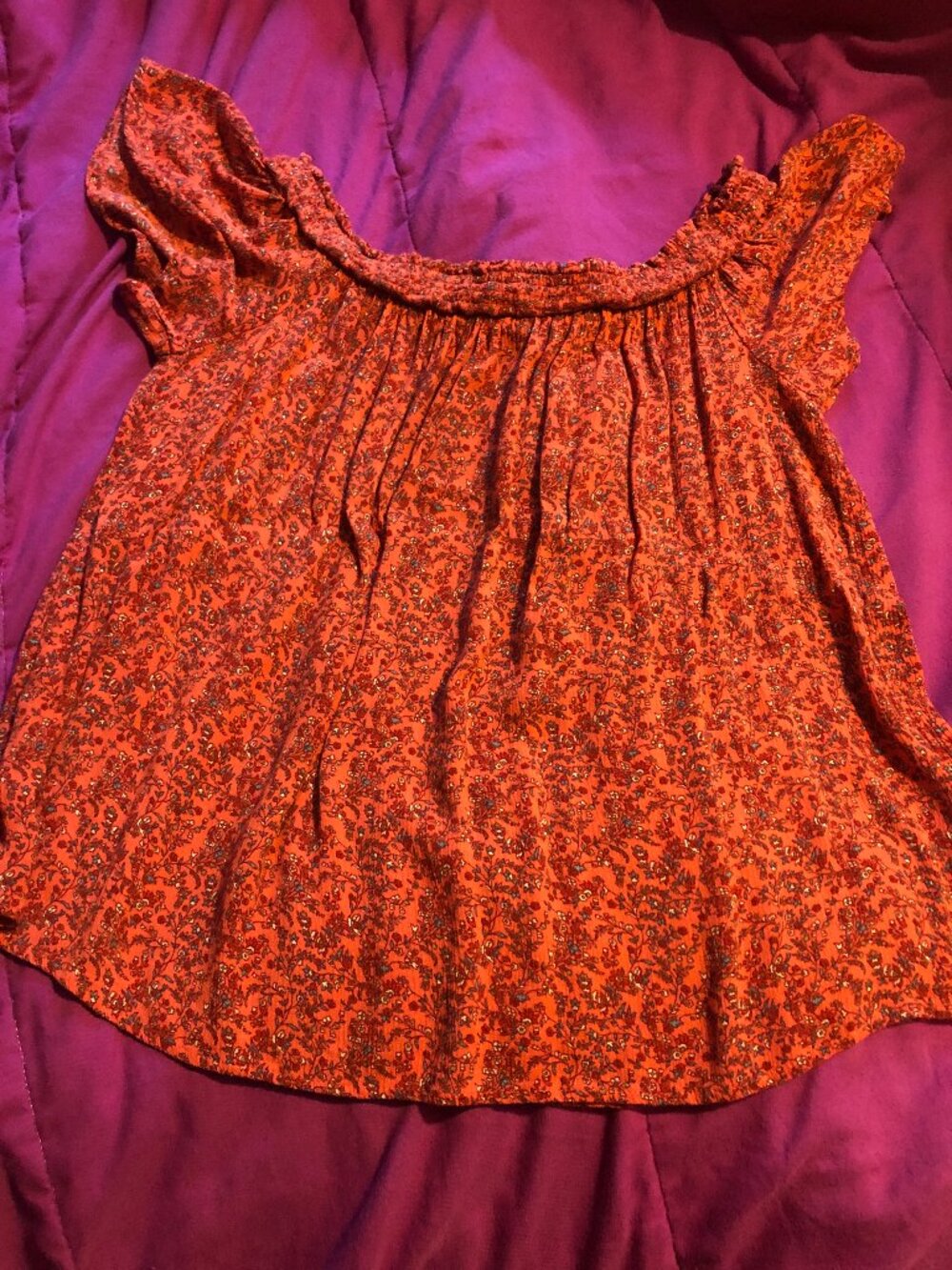 Woman's orange off the shoulder summer blouse